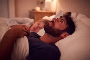 Solopreneur losing sleep over financial stress and bookkeeping anxiety