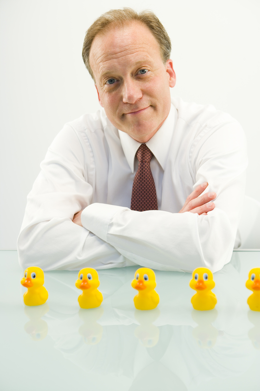 Businessman finished putting all his ducks in a row