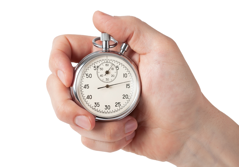 Hand on a stopwatch depicting stopping CRA interest charges