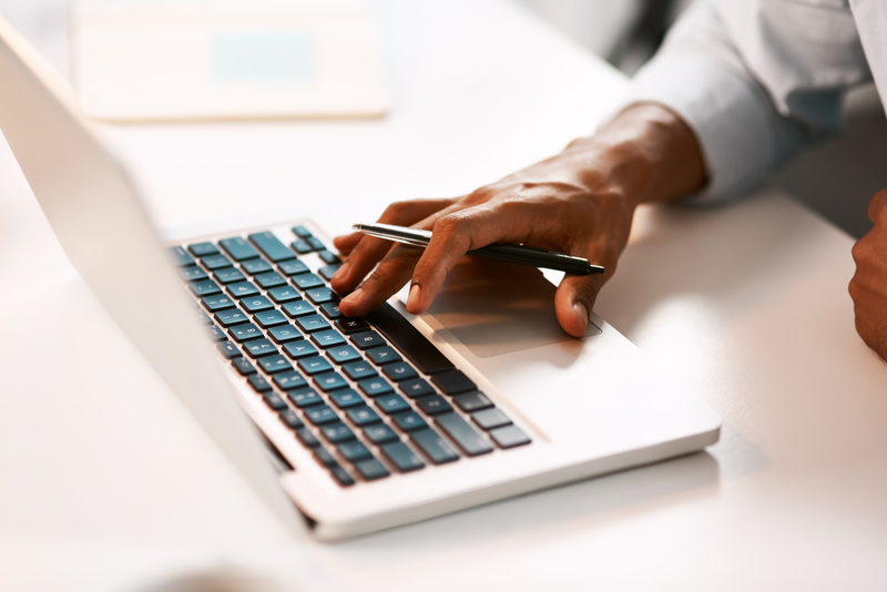 Business person typing on laptop