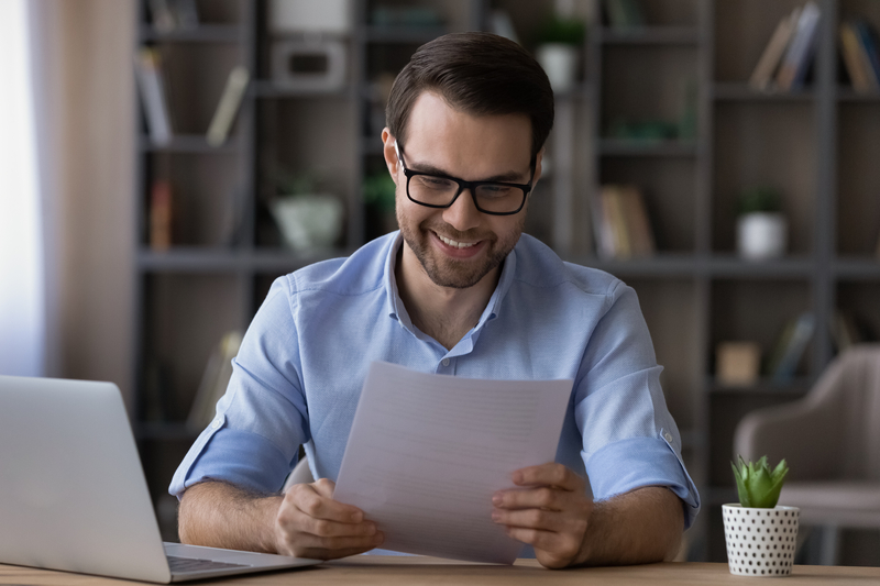 A freelancer happy with his GST report showing a refund