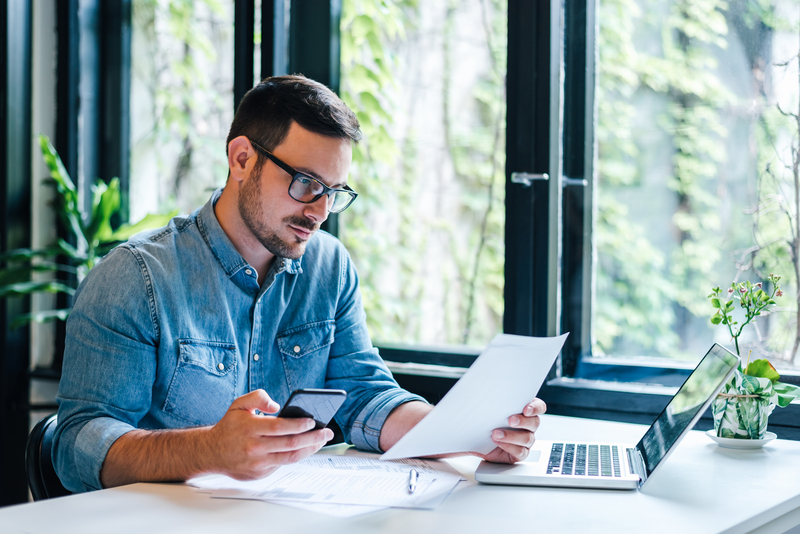 Business owner preparing tariff paperwork