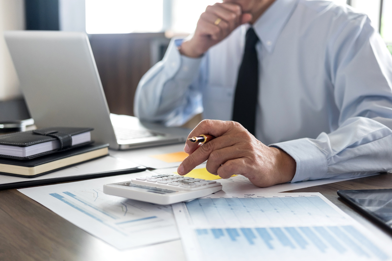 Businessman calculating supplier loan financing being offered