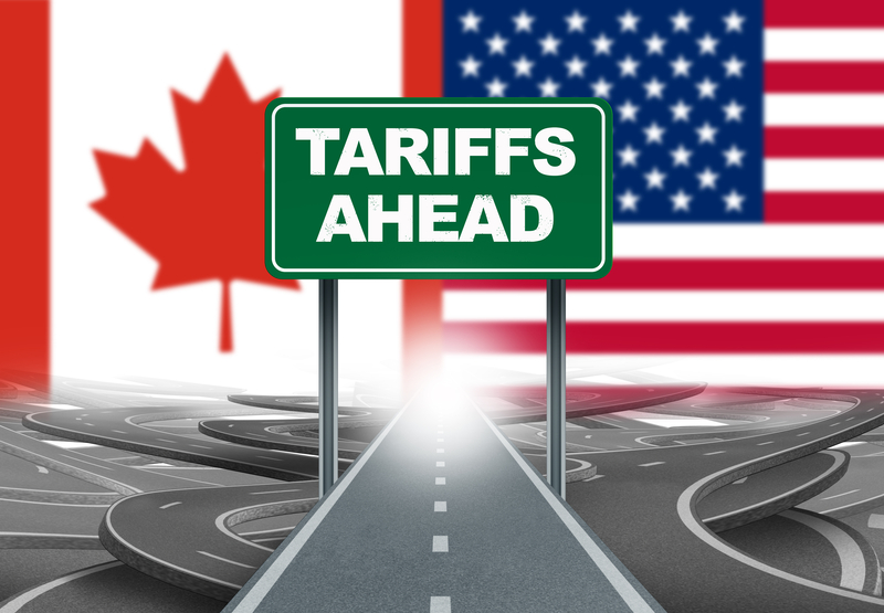 Tariffs Ahead road sign with Canada US flags symbolizing 2025 trade war impact on cross-border business