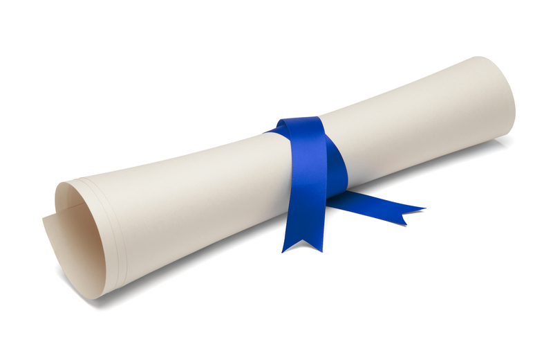 Diploma tied with a blue ribbon Diploma tied with a blue ribbon